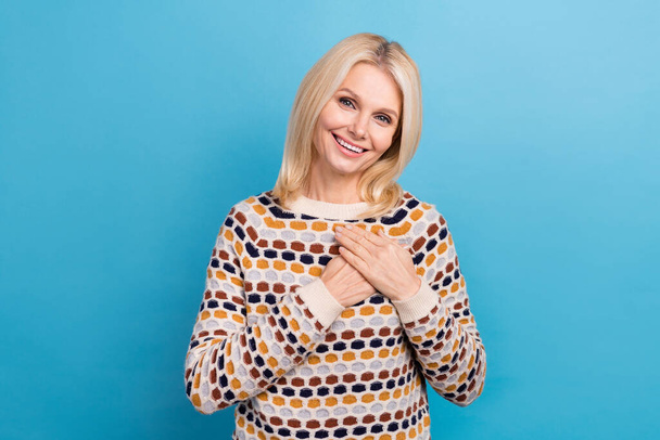 Photo of dreamy adorable girl wear sweater smiling arms chest isolated blue color background. - Φωτογραφία, εικόνα