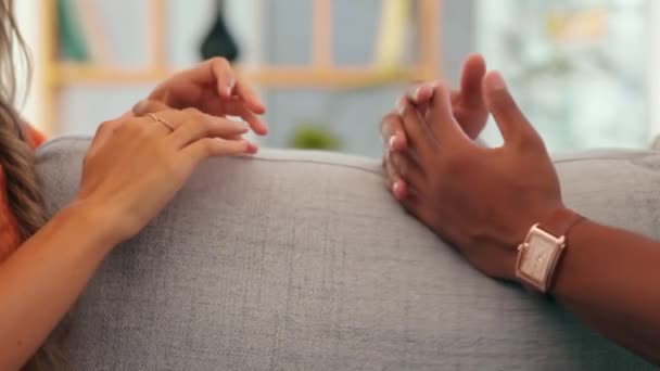 Love, support and couple holding hands on sofa for quality time, bonding and loving affection at home. Relationship, dating and man and woman on couch for connection, talking and in conversation. - Imágenes, Vídeo