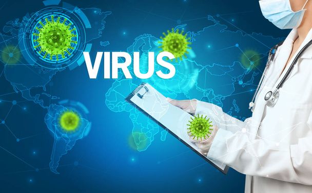 Doctor fills out medical record with VIRUS inscription, virology concept - Photo, Image