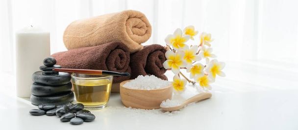 Spa accessory composition set in day spa hotel , beauty wellness center . Spa product are placed in luxury spa resort room , ready for massage therapy from professional service . - Φωτογραφία, εικόνα