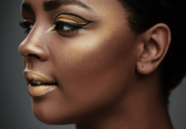 Look for the gold in others. ropped shot of a beautiful young woman having her makeup done - Foto, Imagem