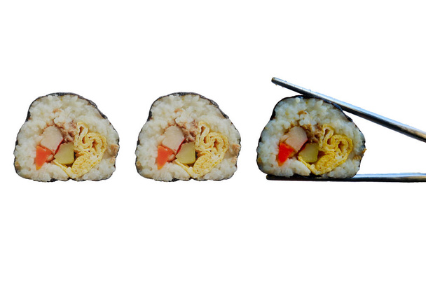 kimbap or gimbap is Korean roll Gimbap(kimbob) made from steamed white rice (bap) and various other ingredients, kimbab and chopstick - Photo, Image