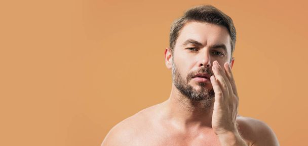 Beautiful man with clean perfect skin. Beauty male skin care. Cosmetology cosmetics beauty and spa. Male facial treatment and wellness. Banner for header, copy space. Poster for web design - 写真・画像