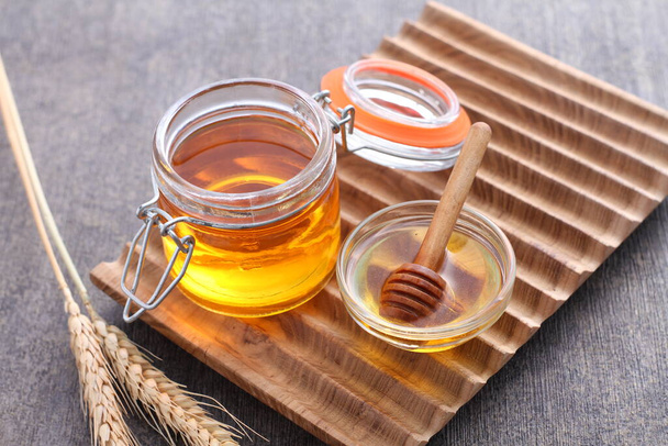 jar with honey and lemon - Photo, Image