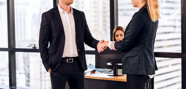 Image two business partner meeting successful handshake together with success join congratulation good deal contract in modern office.Partnership approval and teamwork concept - Photo, Image