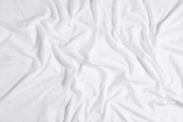 Crumpled white fabric as background, top view - Zdjęcie, obraz