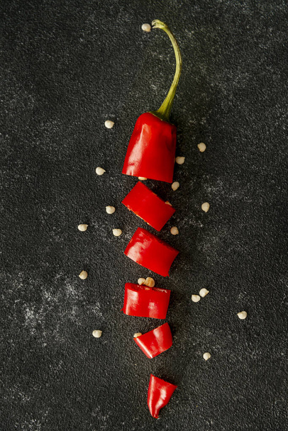 red chili paper on black concrete table dark mood food concept   - Foto, Imagem