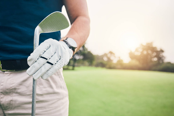 Hand, golf course and stick on grass with space for mockup, summer sports and outdoor sunshine. Golfer man, holding club and mock up for sport, fitness and training on field for professional career. - Photo, Image