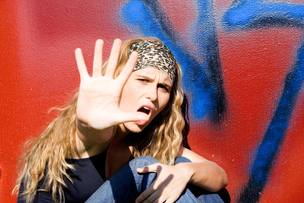 Angry rebellious teen hand up to say no - 写真・画像