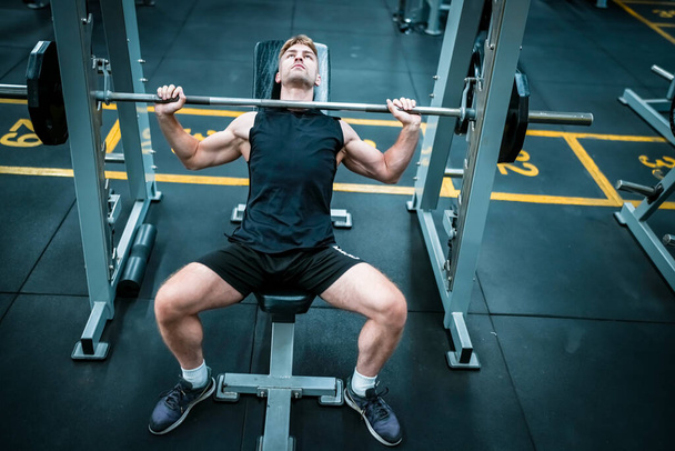 Male athlete exercising in the gym - Photo, Image