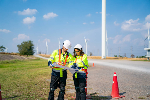 Wind turbine service engineer maintenance and plan for inspection at construction site, renewable electricity generator.  - Photo, Image