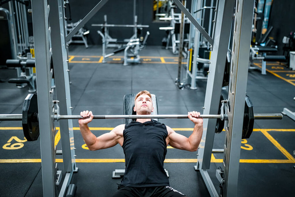 Male athlete exercising in the gym - 写真・画像