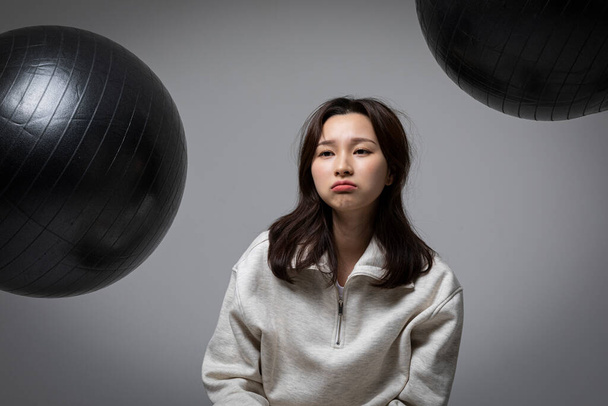 stressed, depressed Korean business woman in pink suit, worrying - Foto, Imagem