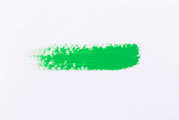 green texture splash stroke of the paint brush on white paper background - Фото, зображення