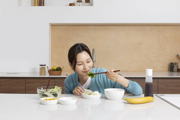 happy single life of korean woman, eating breakfast - Фото, изображение