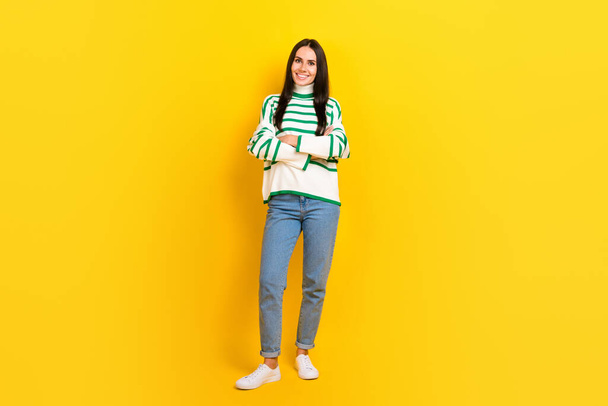 Full length photo of pretty adorable woman wear striped sweater arms crossed isolated yellow color background. - Foto, immagini