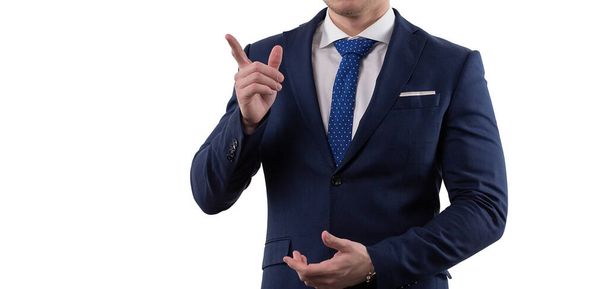 man in a suit and helmet shows the emotions of solving the problem by pointing with his index finger. Concept in the studio on a white background. High quality photo - Foto, imagen