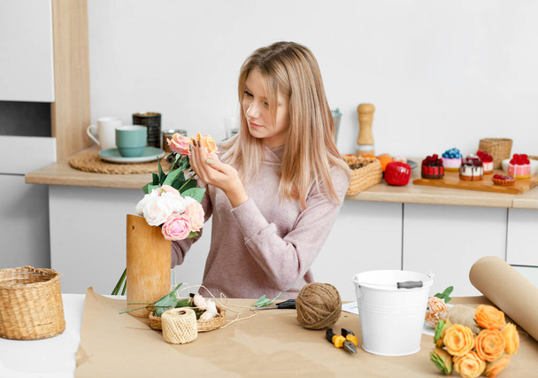 Girls making flowers from soap. Hobby, creative process. DIY gifts. The girl is holding soap flowers in her hands. Handmade soap. Mother's Day, Women's Day. Soap made from natural ingredients. - 写真・画像