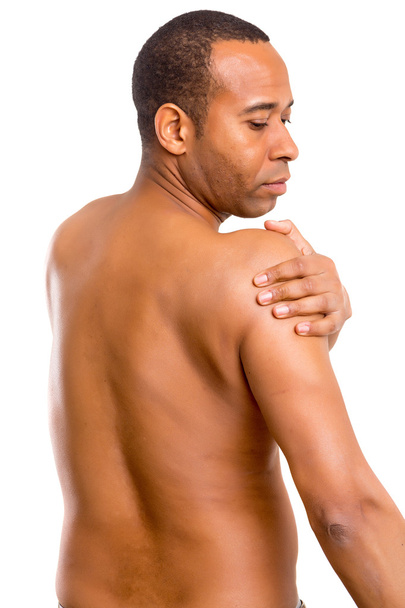 Uomo africano con dolore alla spalla
 - Foto, immagini