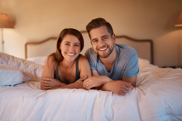We share everything, even our bed. a loving young couple spending quality time together in their bedroom - Foto, immagini