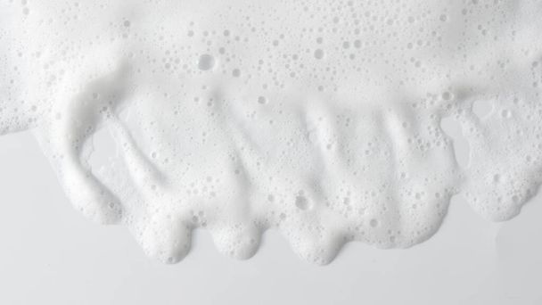 Abstrakti tausta valkoinen saippua vaahto rakenne. Shampoo vaahto kuplia - Valokuva, kuva