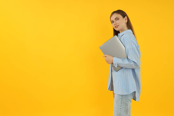Concept of people, young woman on yellow background - Φωτογραφία, εικόνα