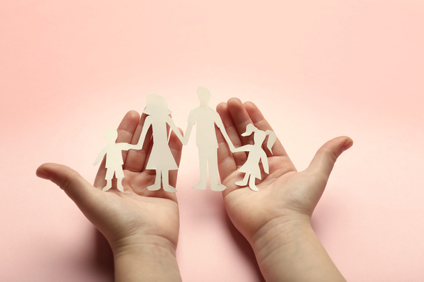 Paper family in child hands - Foto, imagen