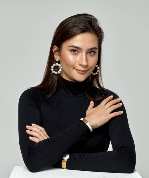 Portrait of beautiful brunette woman wear jewelry isolated on gray background - Фото, изображение