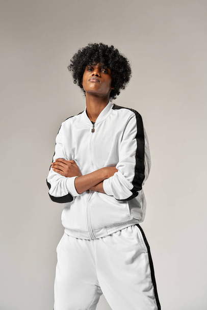 Portrait of fashionable black man in white tracksuit - Valokuva, kuva