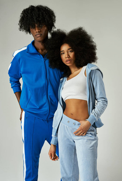 African american couple stylized for the 90s with afro hairstyle isolated on gray background - Foto, Imagen