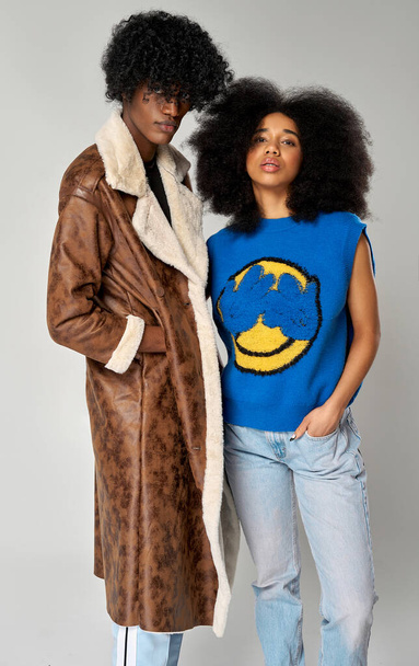 Portrait of african american couple wear stylish  90s fashion clothes with afro hairstyle isolated on gray background - Foto, imagen