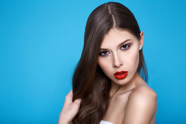 Beautiful sexy woman with evening makeup red lips long hair hand - Фото, зображення