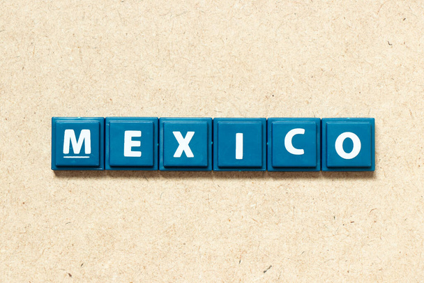 Tile alphabet letter in word mexico on wood background - Fotoğraf, Görsel