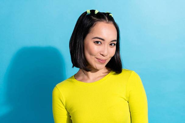 Photo portrait of cute japanese lady wear yellow shirt black ponytails hair smiling posing model daily makeup isolated on blue color background. - Fotografie, Obrázek
