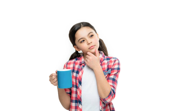 pondering teen girl with morning coffee on background. photo of teen girl with morning coffee cup. teen girl with morning coffee isolated on white. teen girl with morning coffee in studio. - Fotoğraf, Görsel
