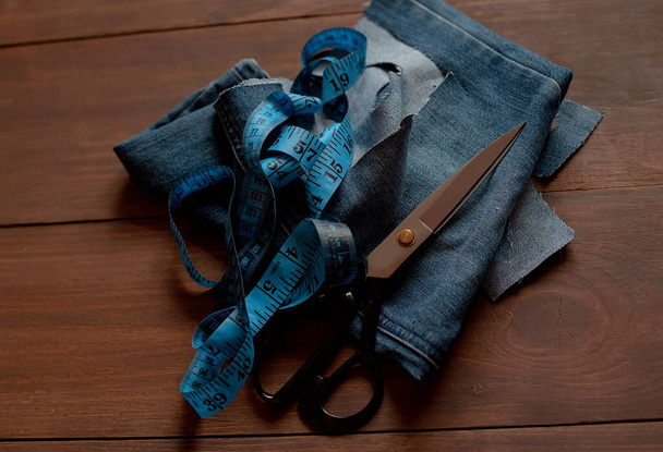 Denim Upcycling Ideas, Using Old Jeans, Repurposing Jeans, Reusing Old Jeans, Upcycle Stuff. Stack of old blue jeans and sewing tools - Photo, Image