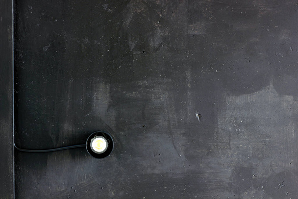 Minimalist black spotlight on industrial black ceiling. Detail of industrial architecture. Industrial background - Foto, Imagen
