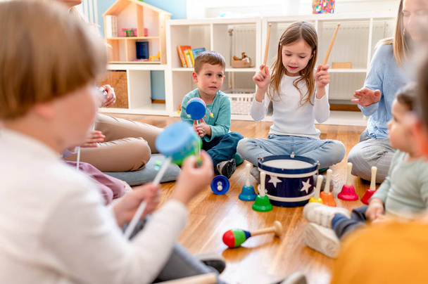 Preschool children with instruments on a music class - Foto, Imagen