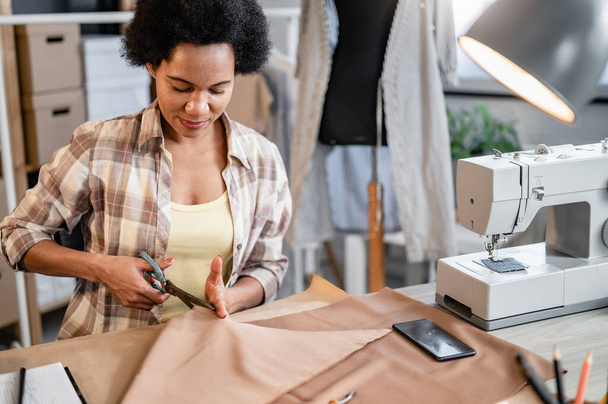 african american woman tailor working at office - Foto, Bild