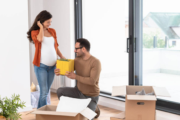 young couple, future parents in new flat - Foto, imagen