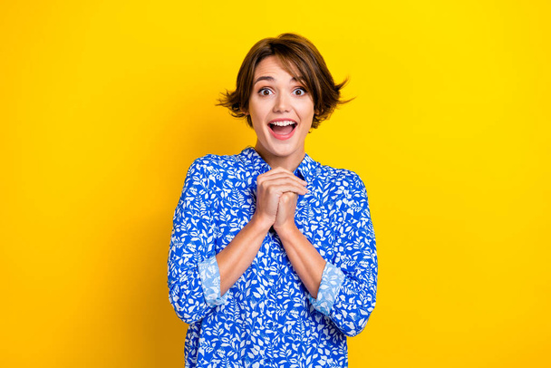 Photo of pretty impressed woman dressed blue blouse smiling open mouth isolated yellow color background. - Foto, Imagen
