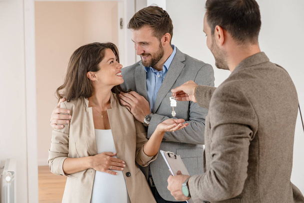 couple buying a new flat with realtor  - Photo, Image