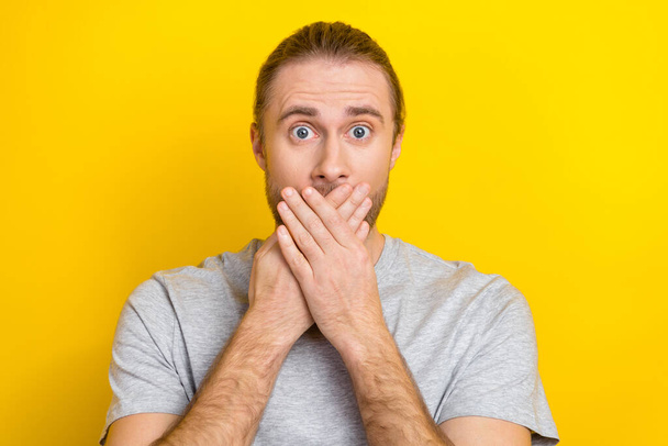 Photo of worried nervous man wear stylish cloths arms cover mouth ears impressed bad news isolated on yellow color background. - Foto, Bild