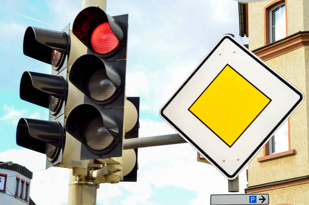 Main road sign and traffic lights in city, closeup - Фото, зображення