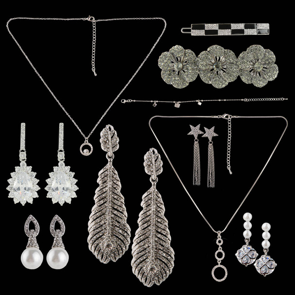 Set of jewelry on a white background. Earrings, hairpins, chains, necklaces. - Photo, Image