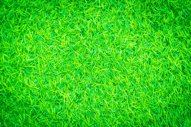 背景に緑の人工芝のテクスチャ - 写真・画像