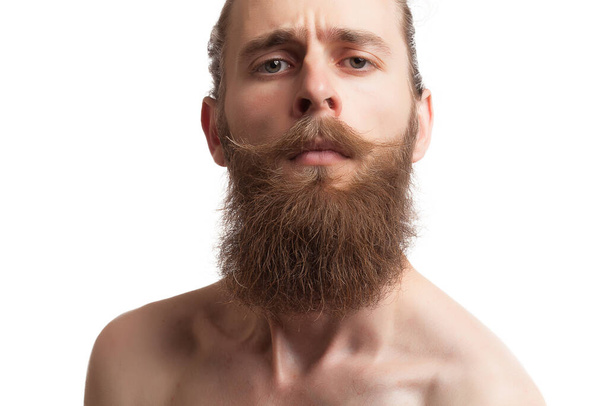 Bearded tattooed hipster on white background in studio photo - Photo, Image