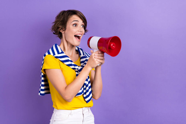 Photo of cheerful excited lady wear stylish tied striped clothes look empty space share good news isolated on purple color background. - Foto, Imagen