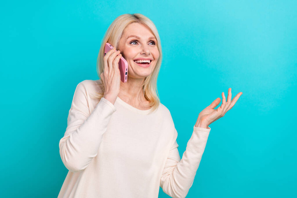 Photo of satisfied business influencer woman wear white shirt conversation call smartphone ecommerce fast network isolated on cyan color background. - 写真・画像