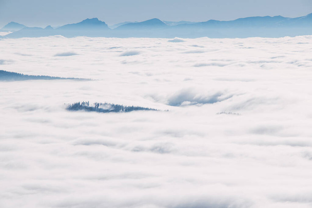 Morning clouds rolling over the scenery and mountains over the Czech Republic creating different formations based on temperature, pressure and airflow. Meteorology. - Fotografie, Obrázek